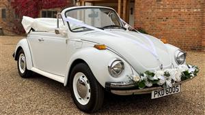 VW Beetle Triple White Wedding car. Click for more information.