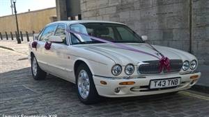 Jaguar XJ8 LWB Wedding car. Click for more information.