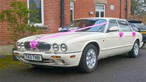 Jaguar XJ8 LWB Wedding car. Click for more information.