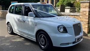 London Eco Taxi Wedding car. Click for more information.