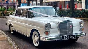 Mercedes 200 Fintail white 1967 Wedding car. Click for more information.